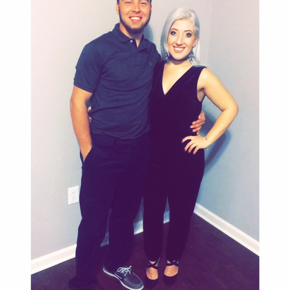 Green envelope Size XS black velvet jumpsuit